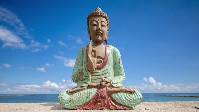 A buddha statue on a beach
