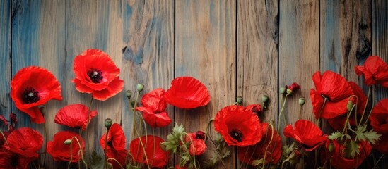 A copy space image of poppy flowers boasting enchanting petals on a rustic wooden backdrop