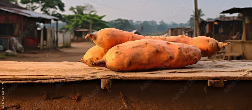 Poster a copy space image of a sweet potato is displayed on a table for sale by the roadside