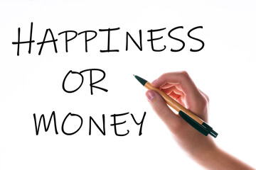 Children hand with pen write on an blue white background. Writing hand. Word Happiness or money