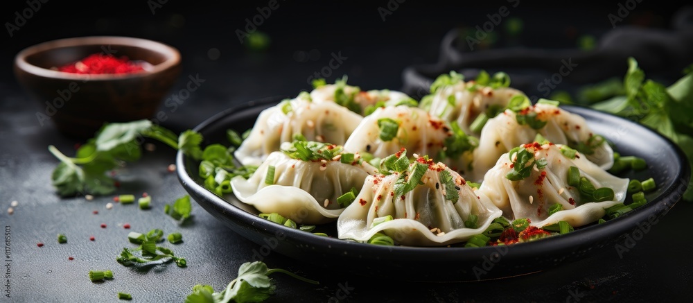 Poster side view close up of dumplings seasoned with pepper salt herbs and microgreens served on a gray con