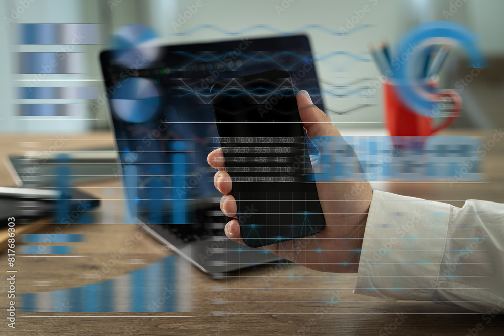 Poster using a computer, an analysis businessman working at a home office while standing at a desk is the d