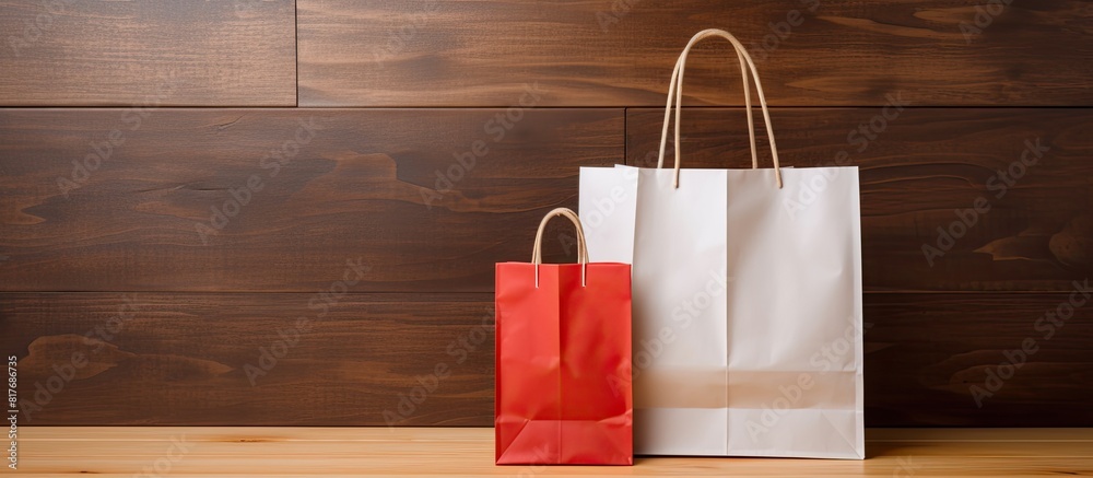 Poster a copy space image of a price tag and paper shopping bag set against a wooden background
