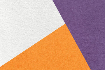 Fototapeta premium Texture of craft violet, white and orange shade color paper background, macro. Vintage abstract purple cardboard