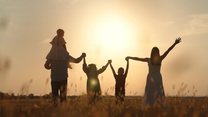 boy girl mother father son daughter dream teamwork hands up sun silhouette religion faith together vacation travel Christianity, children s self-esteem building, parenting time management, child