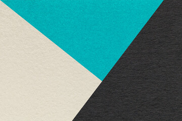Texture of craft beige, black and cyan shade color paper background, macro. Vintage abstract turquoise cardboard