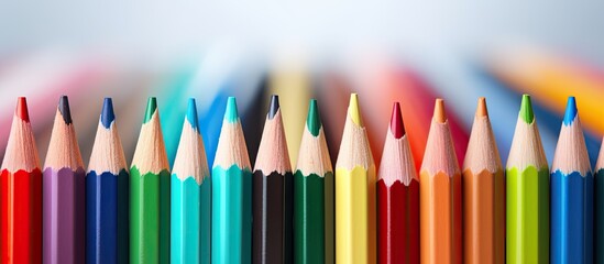 A vibrant array of colored pencils displayed in a copy space image