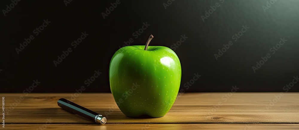 Poster an isolated green apple with a pen stand rests on a wooden background creating an attractive copy sp