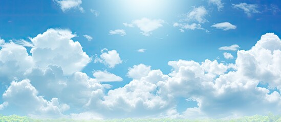 A sunny summer day with blue skies and hole punch clouds creating a picturesque scene The image offers ample empty space for copy