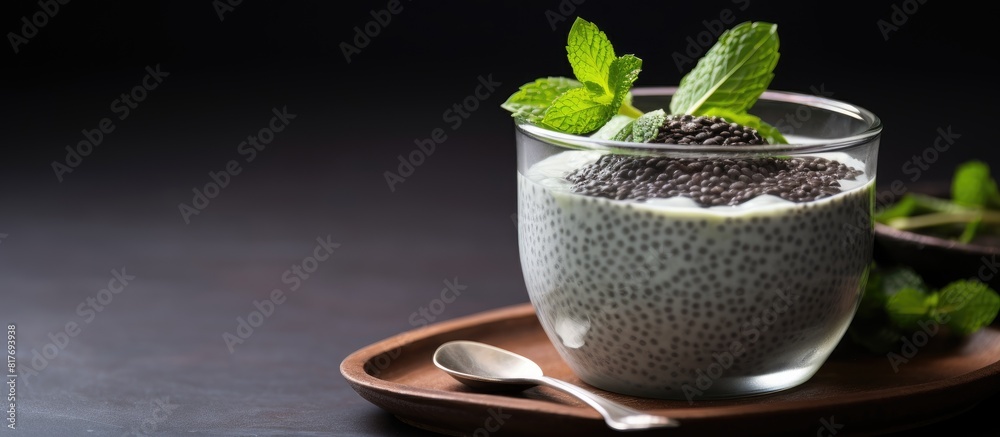 Poster a vegan friendly chia pudding made with black chia seeds and soya milk presented in a simple manner 