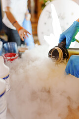 Photo of the process of making ice cream at children's parties using liquid nitrogen. entertainment...