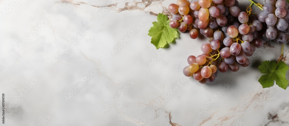 Sticker A top view of wine and grapes on a grey marble background with ample copy space for additional elements or text