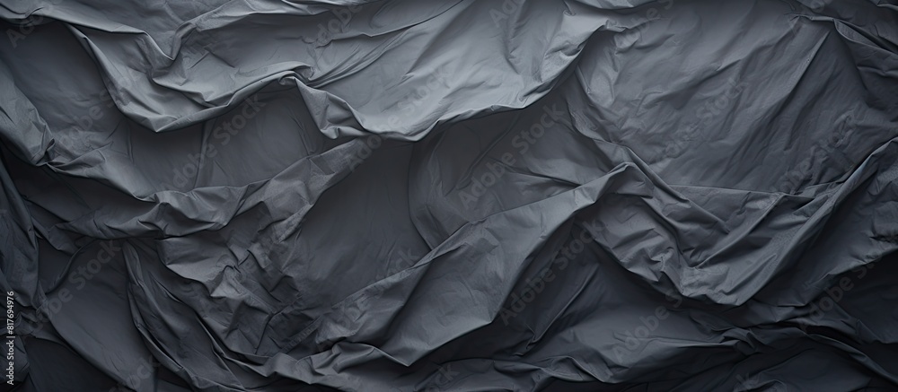 Poster a crumpled piece of dark grey paper creates a textured background perfect for showcasing a copy spac