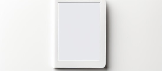 A modern e book reader is placed on a white background creating a flat lay composition with ample room for additional text
