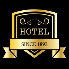 golden emblem hotel logo with shield