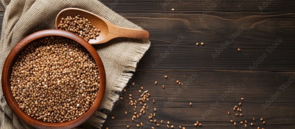 Aufkleber Copy space image of buckwheat groats on a rustic wooden background creating an abstract depiction