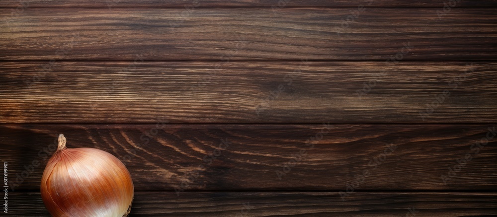 Poster A top down view of a Crimean sweet onion placed on an aged wooden surface creating an appealing copy space image