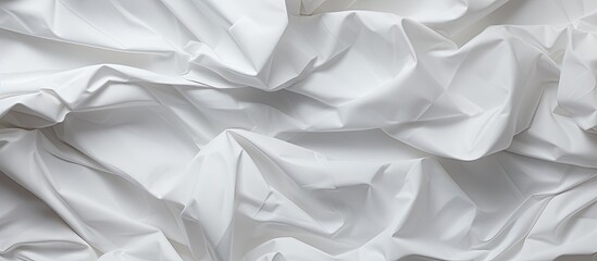 Obraz premium An image of crumpled white paper creating an abstract background with ample copy space