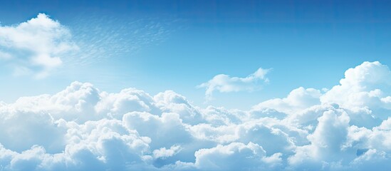 A photo displaying a sunny blue sky filled with fluffy white clouds and ample space for inserting text or images