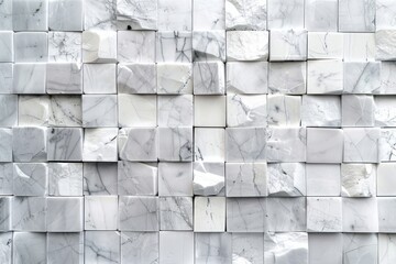 A close-up view of a wall made of white marble cubes with varying textures and patterns