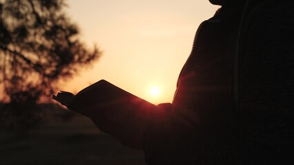 girl woman praying at sunset, hand sunset faith pain, asking heaven for help, bible book, tranquil...