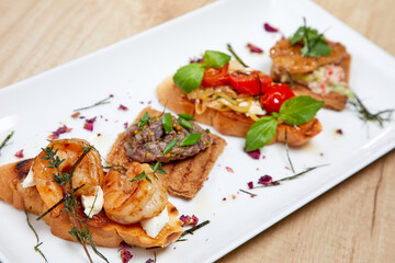 bruschetta with different vegetables and meat