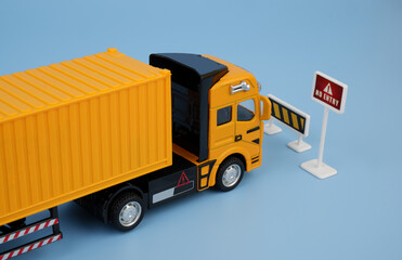 Prohibited trucks traffic concept. Yellow truck and road sign no entry.