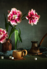 A cup of hot, aromatic coffee and a bouquet of peony tulips. Still life.