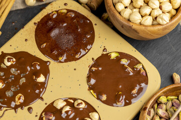 making homemade chocolate with cocoa butter and nuts