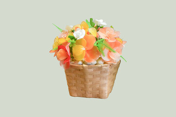 Isolated nylon flower in vase on light green background with clipping paths.