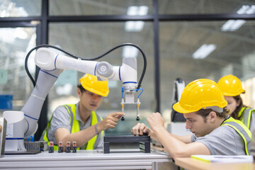 Trainees focus on robot arms, automation programs, and essential skills in the robotics academy.