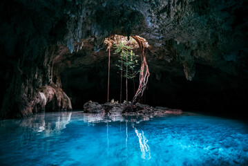 Scenic view of Sac Actun Cenote with blue water in Tulum, Mexico