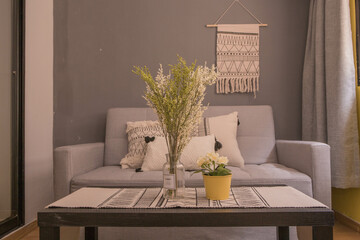 Interior design of a modern room with a sofa next to bedroom