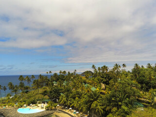 an island with many trees and pool near the beach and water, Sao Tome, Africa