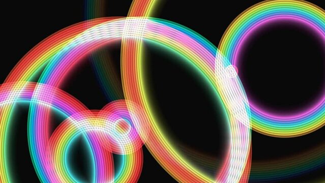 An abstract image showcasing colorful neon light trails overlapping and intersecting against a black background. The dynamic arrangement of vibrant circles and curves creates a sense of motion