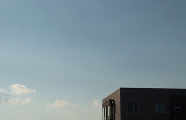 a part of a building and the sky