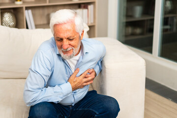 Pain on heart, heart attack. Unhappy middle aged senior man suffering from chest pain heart attack...
