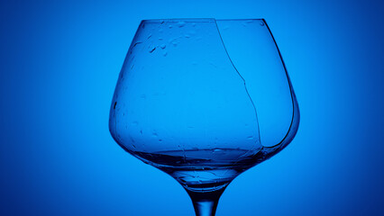 Broken glass against a bright blue background