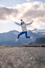 a girl is jumping in the air while on her skateboard