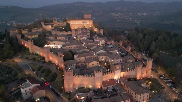 Drone footage of Gradara Castle (Castello di Gradara) at sunset in Gradara town, Italy
