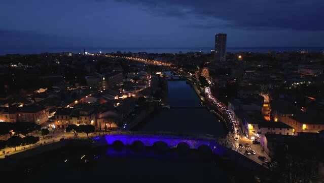Drone footage of Tiberius Bridge (Ponte di Tiberio) over Marecchia River in Rimini city, Italy