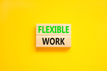 Flexible work symbol. Concept words Flexible work on beautiful wooden block. Beautiful yellow paper...