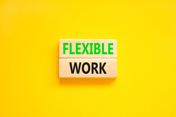 Flexible work symbol. Concept words Flexible work on beautiful wooden block. Beautiful yellow paper background. Business Flexible work concept. Copy space.