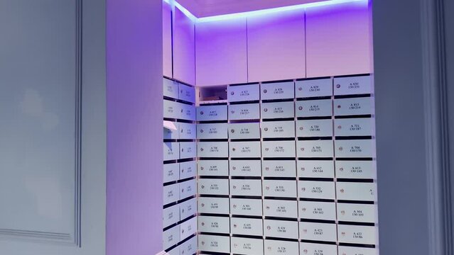 Blue mailboxes with neon lighting