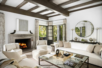 Interior design of a living room featuring white leather sofas with a rectangular glass coffee table