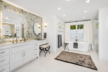 Contemporary bathroom interior featuring two modern washbasins and a pair of inviting bathtubs