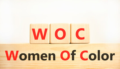 WOC women of color symbol. Concept words WOC women of color on beautiful wooden blocks. Beautiful...