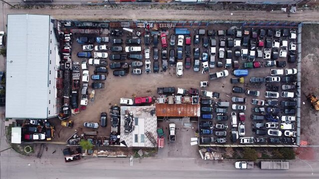 Top-down drone shot of the wrecked car yard.