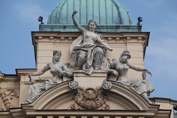 Obraz premium Classical sculptures on the facade of the Juliusz Slowacki Theatre in Krakow, Poland
