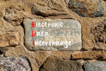 EDI electronic data interchange symbol. Concept words EDI electronic data interchange on big stone....